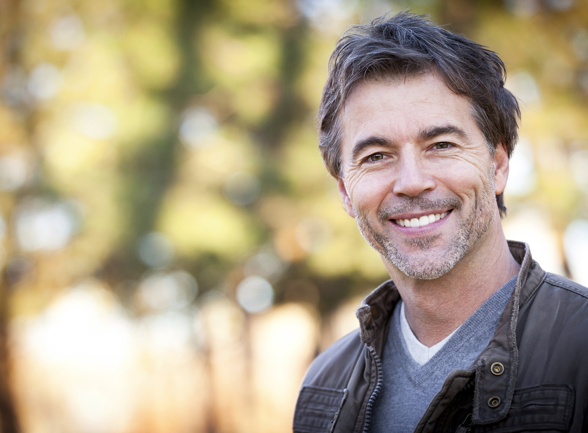 A dentist and patient discuss personalized dental implant options.